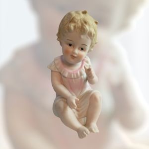 Vintage bisque‎ piano baby figurine by Andrea. Little girl